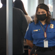 Transportation Security Administration (TSA) workers screen passengers at O’Hare International Airport on November 08, 2021 in Chicago, Illinois.